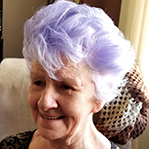 elderly woman with purple hair